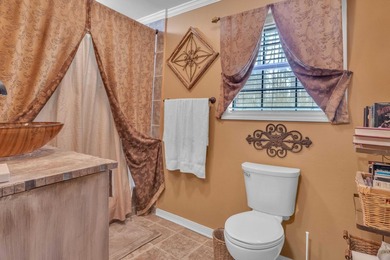 Nestled on a hill, this charming 4-bedroom, 2.5-bath home is - photo 17