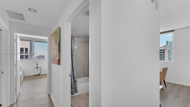 A must-see corner residence at Vizcayne Condominium featuring