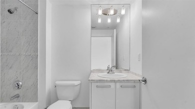 A must-see corner residence at Vizcayne Condominium featuring