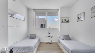 A must-see corner residence at Vizcayne Condominium featuring