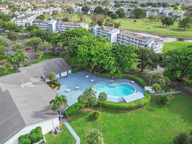 Bright and Stunning Corner unit with lake & Golf views, located