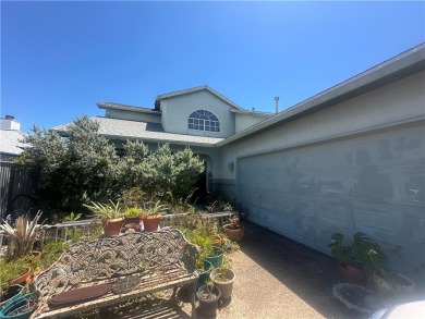 Nestled along a wide canal in Corpus Christi, this 3-bedroom, 2