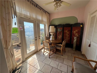 Nestled along a wide canal in Corpus Christi, this 3-bedroom, 2