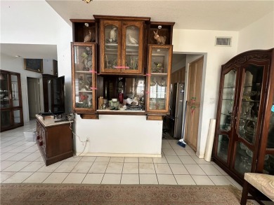 Nestled along a wide canal in Corpus Christi, this 3-bedroom, 2