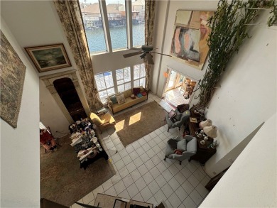 Nestled along a wide canal in Corpus Christi, this 3-bedroom, 2