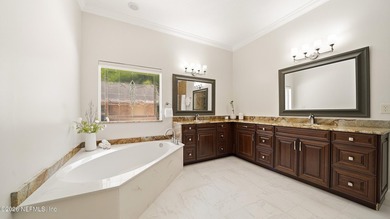 Tucked away on a peaceful private road, this custom-built full - photo 33