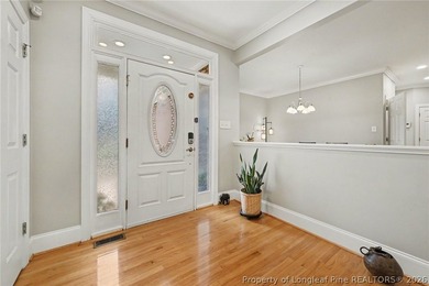 Rare main-level living in Treyburn with private wooded views and - photo 3