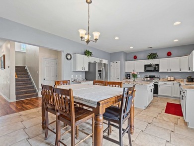Welcome to this spacious three-story home with peaceful pond - photo 12