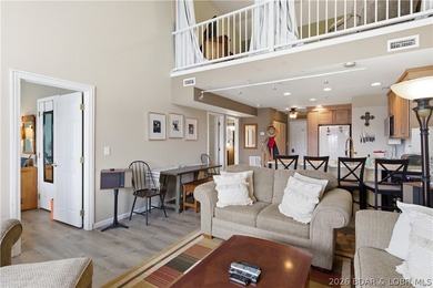 Top-floor condo with soaring vaulted ceilings and dramatic - photo 12