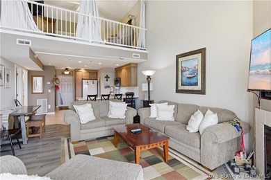 Top-floor condo with soaring vaulted ceilings and dramatic - photo 13