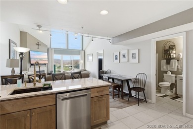 Top-floor condo with soaring vaulted ceilings and dramatic - photo 15