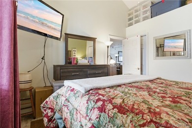 Top-floor condo with soaring vaulted ceilings and dramatic - photo 23