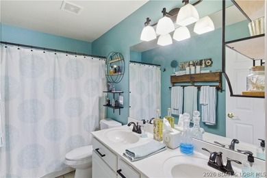 Top-floor condo with soaring vaulted ceilings and dramatic - photo 32