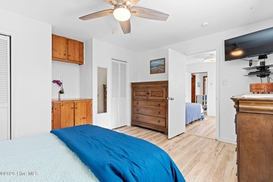 Tucked along a quiet street, this charming coastal cottage