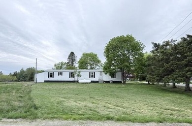 Affordable in-town mobile home situated on a spacious corner lot - photo 1