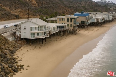 This beach house sits right on the sand, where floor-to-ceiling - photo 1