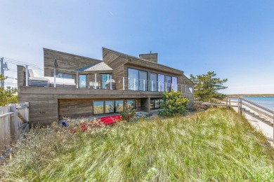 Located on Amagansett's coveted Cranberry Hole Road, this - photo 1