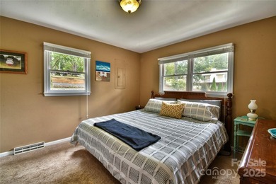 This waterfront home is located off Badin Lake's main channel - photo 36