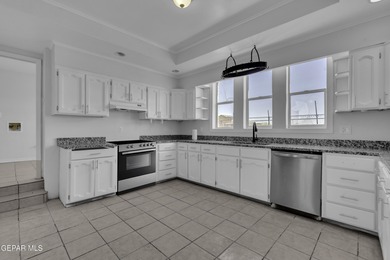 Welcome to this beautifully remodeled two-story home featuring 5