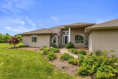 Set back on 5.38 waterfront acres in Mahomet, this custom-built - photo 2