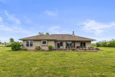 Set back on 5.38 waterfront acres in Mahomet, this custom-built - photo 4