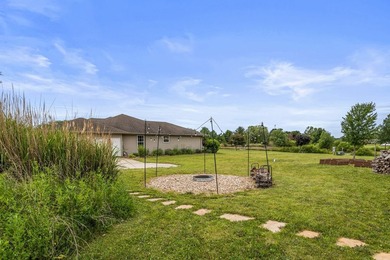 Set back on 5.38 waterfront acres in Mahomet, this custom-built - photo 8