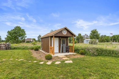 Set back on 5.38 waterfront acres in Mahomet, this custom-built - photo 9