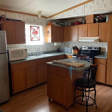 Discover peaceful lake living with this charming and - photo 23