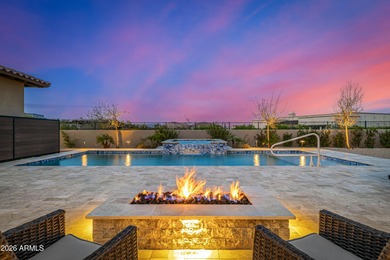 Set on a 1-acre site, this custom estate in the Boulder Ranch