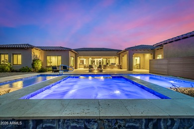 Set on a 1-acre site, this custom estate in the Boulder Ranch