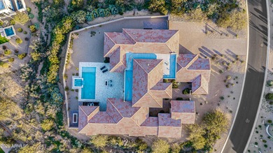 Set on a 1-acre site, this custom estate in the Boulder Ranch