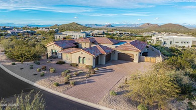 Set on a 1-acre site, this custom estate in the Boulder Ranch