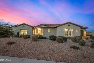 Set on a 1-acre site, this custom estate in the Boulder Ranch