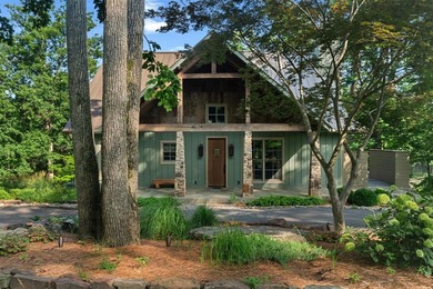 Experience lake living at its finest in this custom-built - photo 1