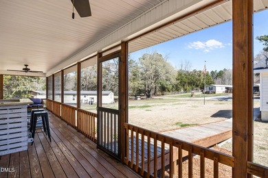 Custom-built home at Kerr Lake offering breathtaking water views - photo 12