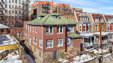 Beautiful and unique oversized brick 3 family home. Great - photo 1