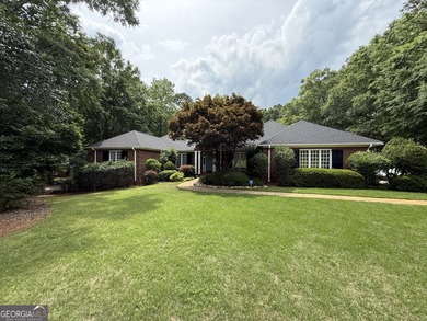 Lakeside Living at Its Finest! This captivating custom-built - photo 2