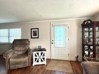A cozy covered porch is where the tour begins! A custom leaded - photo 9