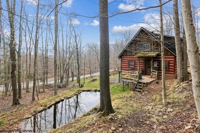 Tucked away on a serene 2-acre wooded lot in the highly - photo 1