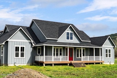 This newly built home sits on a large acreage lot in the heart - photo 1