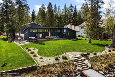 Set along the water's edge on a .44-acre lot, this beautifully - photo 3