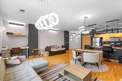 Urban living at its best. The open-concept layout is ideal for - photo 5