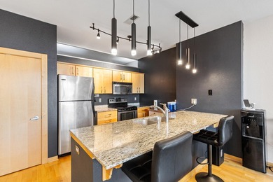 Urban living at its best. The open-concept layout is ideal for - photo 7