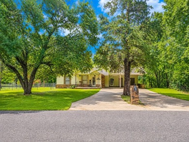 Charming retreat near the water! Nestled on almost an acre, this - photo 1