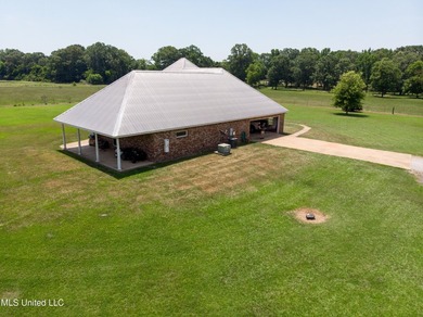This custom-built equestrian property in Terry offers a - photo 8
