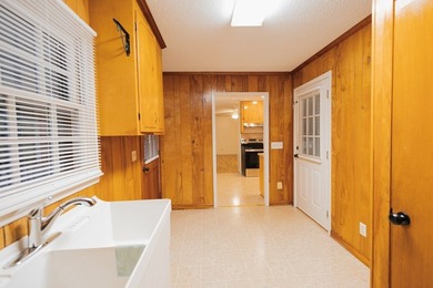 This classic ranch-style home sits gracefully on 62 sprawling - photo 28