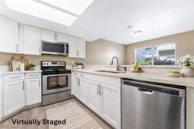 Don't miss this beautifully updated first-floor condo in a very