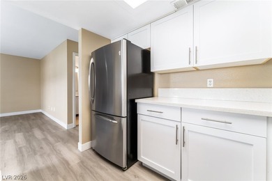 Don't miss this beautifully updated first-floor condo in a very