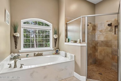 Nestled on a serene nearly 1 acre wooded homesite, this - photo 12