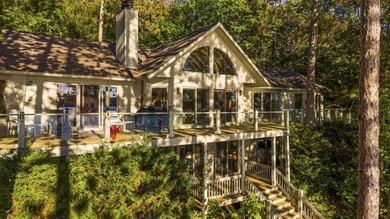 Perched among the whispering pines on Walloon Lake's desirable - photo 14
